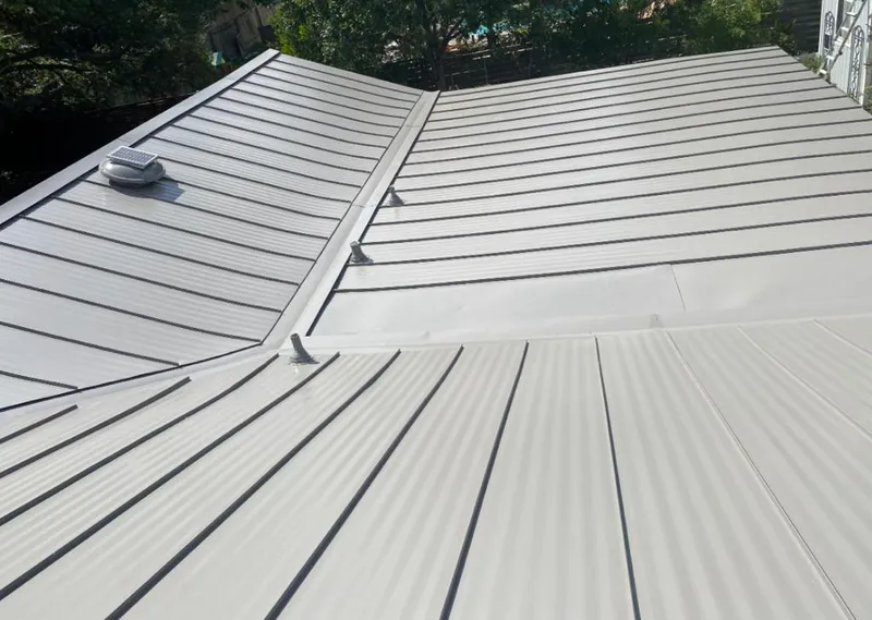 Solar attic fan installed on a metal roof for Roof Ventilation in Skiatook